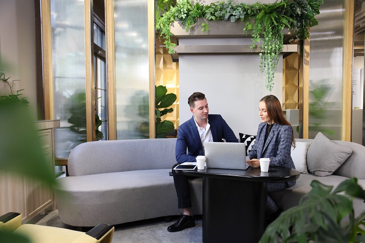 working colleagues sitting on couch