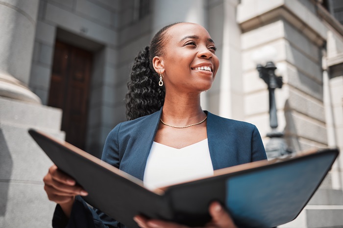 businesswoman in public with a portfolio