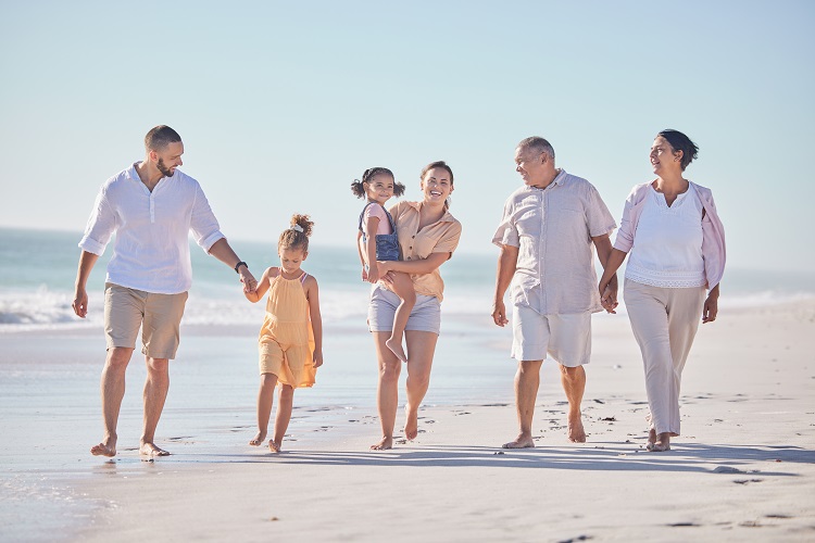 happy family walking on beach