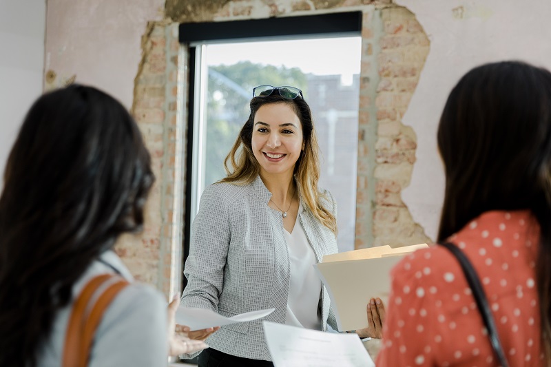 realtor talking with clients