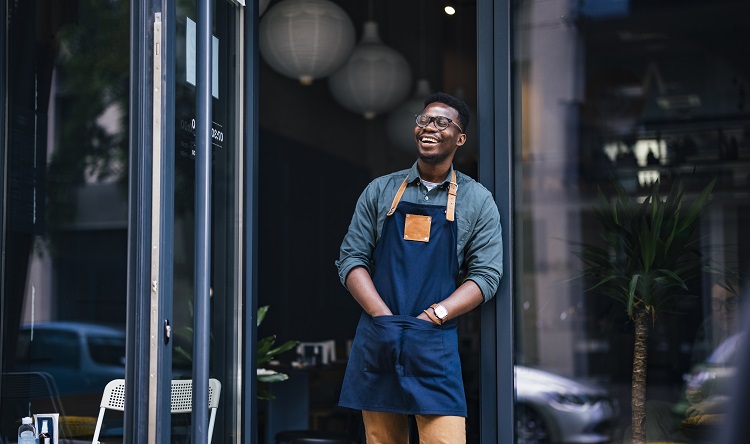 chef standing outside laughing