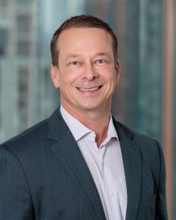 professional headshot of Adam Stoecker