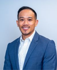 headshot of Reggie Ouk.